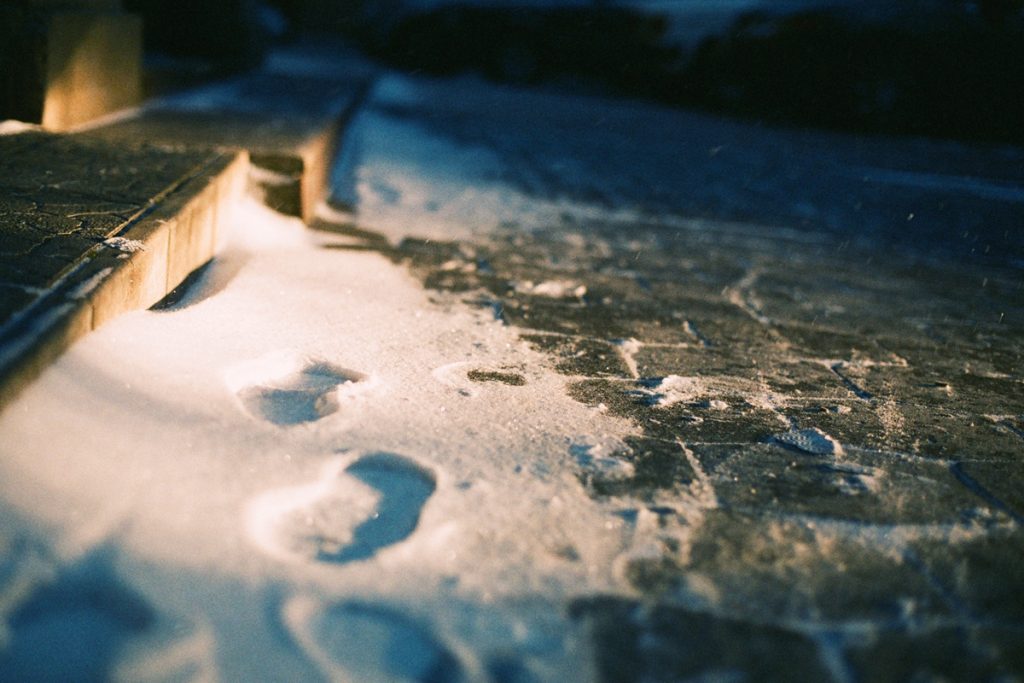 footprints in the snow from human shoes in a snowy winter