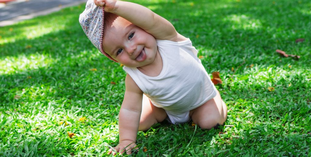 happy baby in a garden