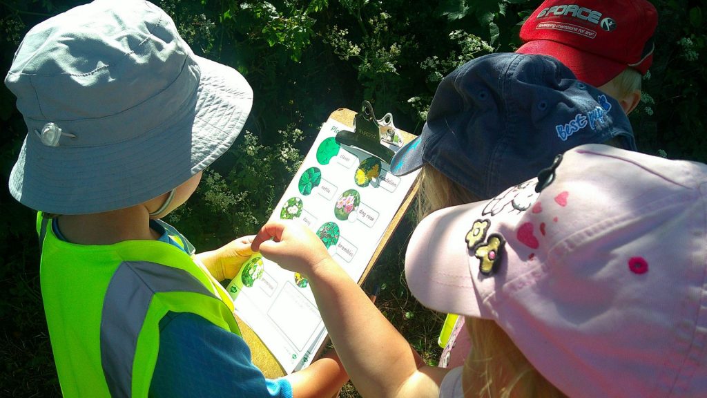 children in Blue Windmill Nursery garden in Rugby