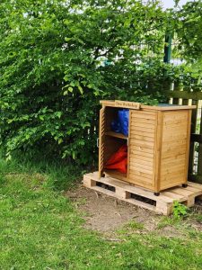The Den Workshop and play zone at blue windmill nursery in the garden at Rugby