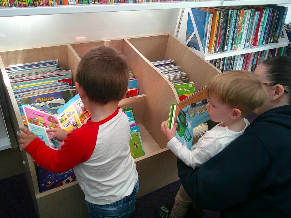 babies choosing books at the mobile library near Blue Windmill Nursery